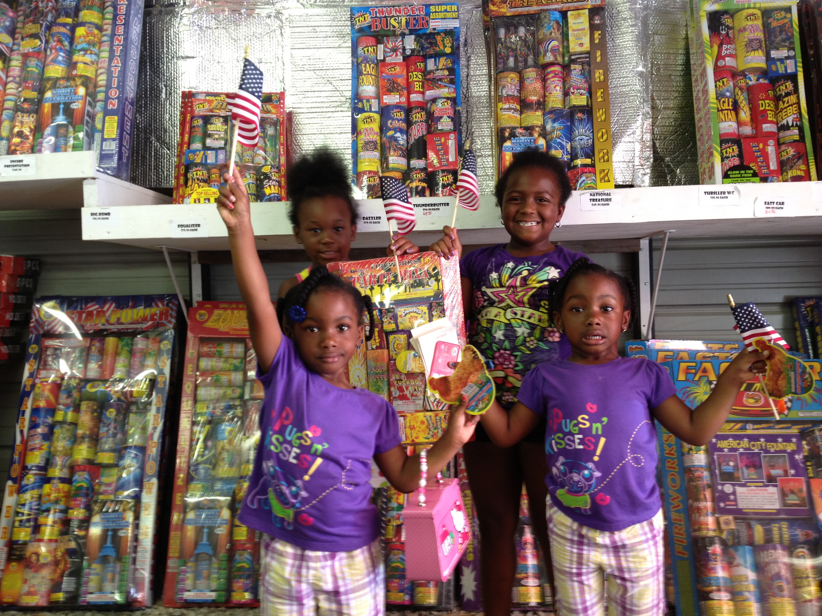 four girls in front of assortment display